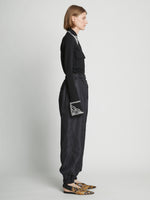 Side full length image of model wearing Silk Nylon Taffeta Pants in BLACK