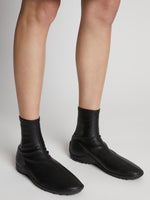 Image of model wearing Grip Stretch Ankle Boots in BLACK