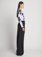 Side full length image of model wearing Printed Floral T-Shirt in PURPLE MULTI