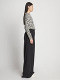 Side full length image of model wearing Printed Floral T-Shirt in BLACK MULTI