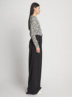 Side full length image of model wearing Printed Floral T-Shirt in BLACK MULTI