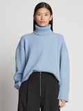 Cropped front image of model wearing Doubleface Cashmere Oversized Turtleneck in light blue