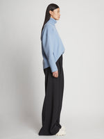 Side image of model wearing Doubleface Cashmere Oversized Turtleneck in light blue