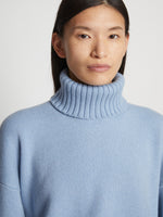 Detail image of model wearing Doubleface Cashmere Oversized Turtleneck in light blue