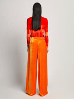 Back image of model wearing Viscose Knit Tie Dye Top in orange multi