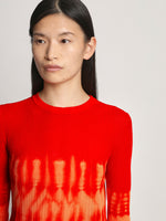 Detail image of model wearing Viscose Knit Tie Dye Top in orange multi