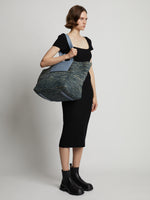 Image of model wearing XL Morris Raffia Tote in DOVE GREY