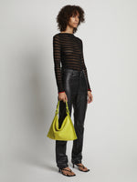 Image of model wearing Minetta Suede Bag in MATCHA