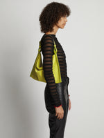 Image of model wearing Minetta Suede Bag in MATCHA