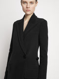 Proenza Schouler detail image of model wearing Bi-Stretch Crepe Wrap Coat in black