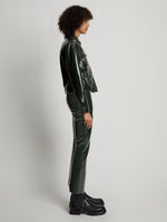 Side image of model wearing Vinyl Cropped Jacket in pine