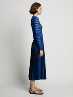 Side image of model wearing Sheer Stripe Knit Skirt in cerulean/black