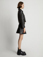 Side image of model wearing Cropped Leather Blazer in black