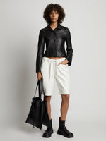 Front image of model wearing Faux Leather Shorts in off white