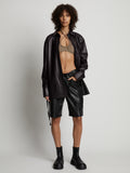 Front image of model wearing Faux Leather Shirt Jacket in black