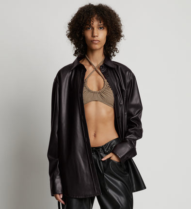 Cropped front image of model wearing Faux Leather Shirt Jacket in black