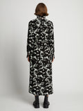 Back image of model wearing Printed Long Sleeve Shirt Dress in mint/black
