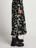 Detail image of model wearing Printed Long Sleeve Shirt Dress in mint/black