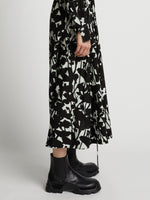 Detail image of model wearing Printed Long Sleeve Shirt Dress in mint/black