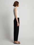 Side image of model wearing Sweatshirt Tank Top in off white