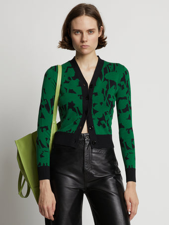 Cropped front image of model wearing Knit Floral Cardigan in green/black
