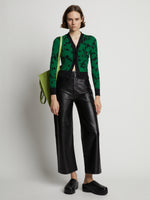 Front image of model wearing Knit Floral Cardigan in green/black