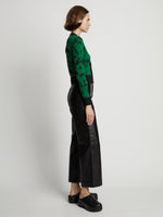 Side image of model wearing Knit Floral Cardigan in green/black