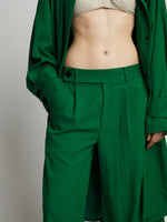 Detail image of model wearing Drapey Suiting Wide Leg Pant in green