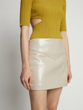 Detail image of model wearing Vinyl Mini Skirt in fawn