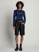 Front image of model wearing Faux Leather Shorts in black
