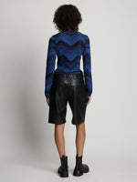 Back image of model wearing Faux Leather Shorts in black