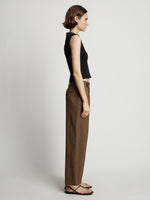 Side image of model wearing Sweatshirt Tank Top in black