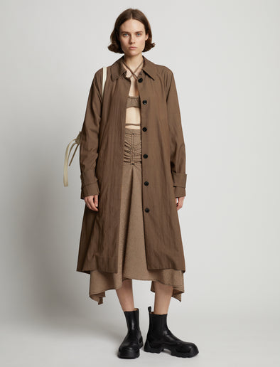 Front image of model wearing Drapey Suiting Trench Coat in coffee