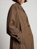 Detail image of model wearing Drapey Suiting Trench Coat in coffee