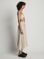 Side image of model wearing Gingham Tie Front Midi Skirt in buttercream/fawn