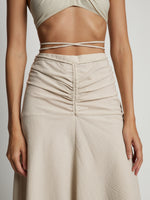 Detail image of model wearing Gingham Tie Front Midi Skirt in buttercream/fawn
