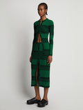 Side image of model wearing Mini Stripe Button Front Skirt in green/black