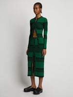 Side image of model wearing Mini Stripe Button Front Skirt in green/black