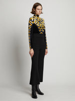 Side image of model wearing Wool Bi-Stretch Suiting Pants in black