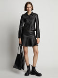 Front image of model wearing Leather Ruffle Mini Skirt in black