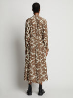 Back image of model wearing Printed Long Sleeve Shirt Dress in buttercream/coffee