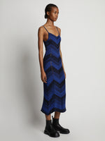 Side image of model wearing Marled Stripe Knit Maxi Dress in cerulean/black