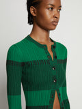Detail image of model wearing Mini Stripe Cardigan in green/black