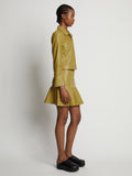Side image of model wearing Cropped Leather Blazer in sulphur