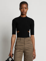 Cropped front image of model wearing Rib Knit Cut Out Sweater in black