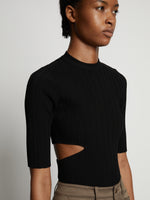 Detail image of model wearing Rib Knit Cut Out Sweater in black