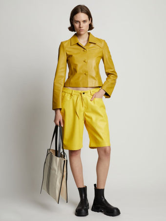 Front full length image of model wearing Faux Leather Shorts in SUN