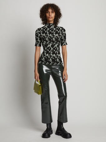 Front image of model wearing Vinyl Cropped Pant in pine