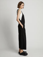 Side image of model wearing Drapey Suiting Wide Leg Jumpsuit in black