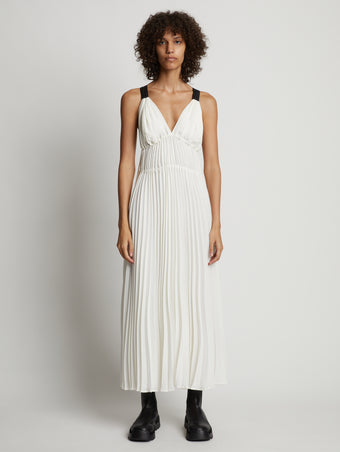 Front image of model wearing Broomstick Pleated Tank Dress in off white